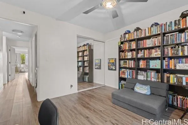 a bedroom with furniture and a book shelf