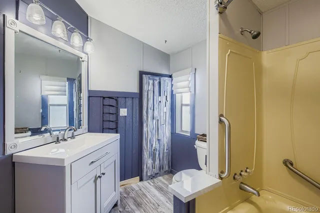 a bathroom with a sink double vanity and a mirror
