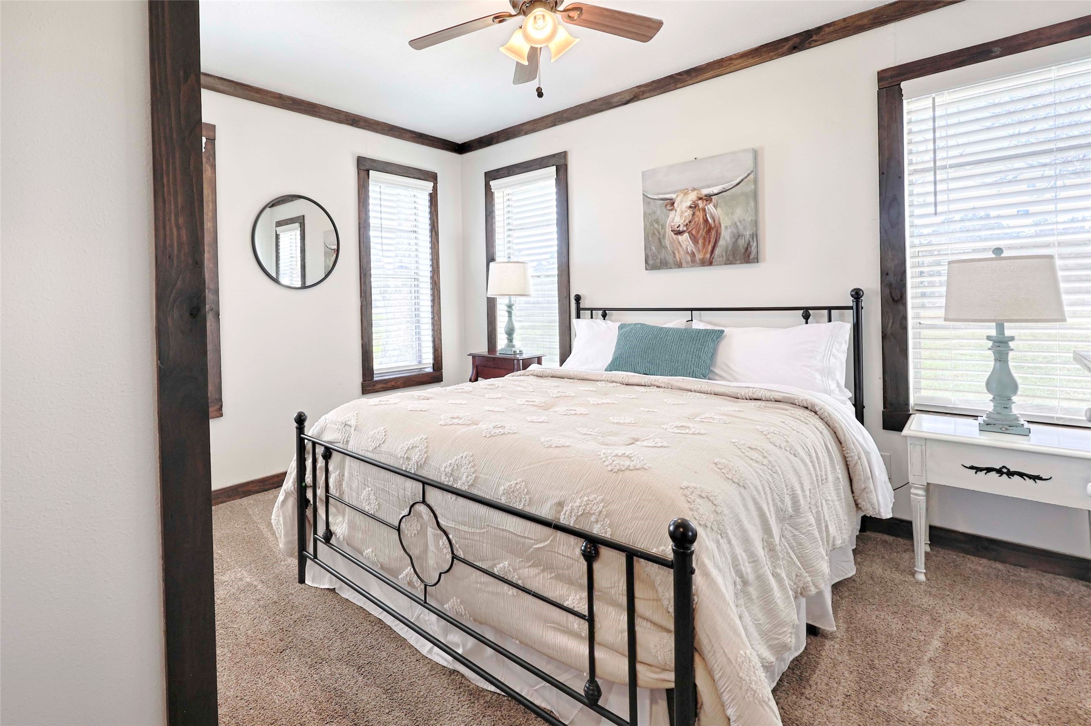 1055 County Road Weimar, TX 78962 - Photo 16 of 35 Well-appointed secondary bedroom offering classic country charm, neutral tones, and a relaxing atmosphere.