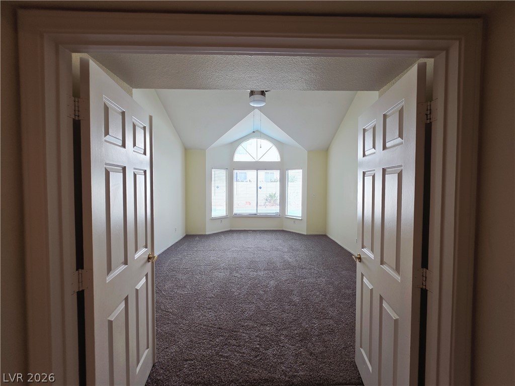 2920 Setting Sun Street Las Vegas, NV 89117 - Photo 22 of 43 This expansive room features vaulted ceilings and ample natural light through a large bay window.
