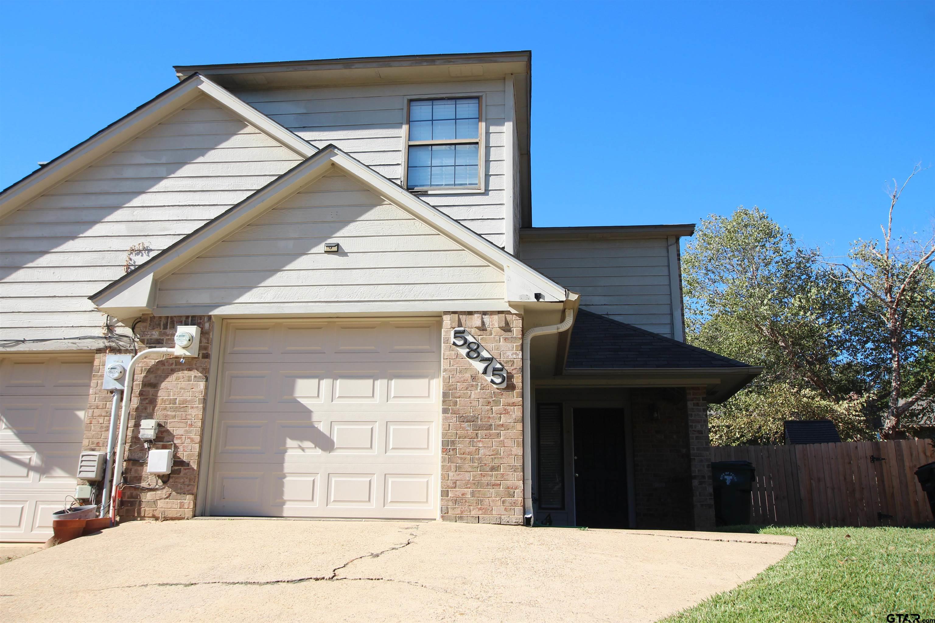 5875 Creekside Circle Tyler, TX 75703 - Photo 1 of 32 a view of a house with a backyard