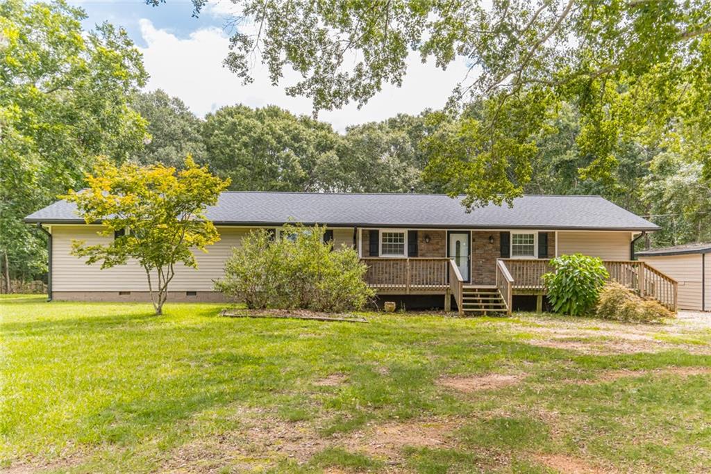 3553 Perry Smith Road Northwest Monroe, GA 30656 - Photo 1 of 1 a front view of a house with garden