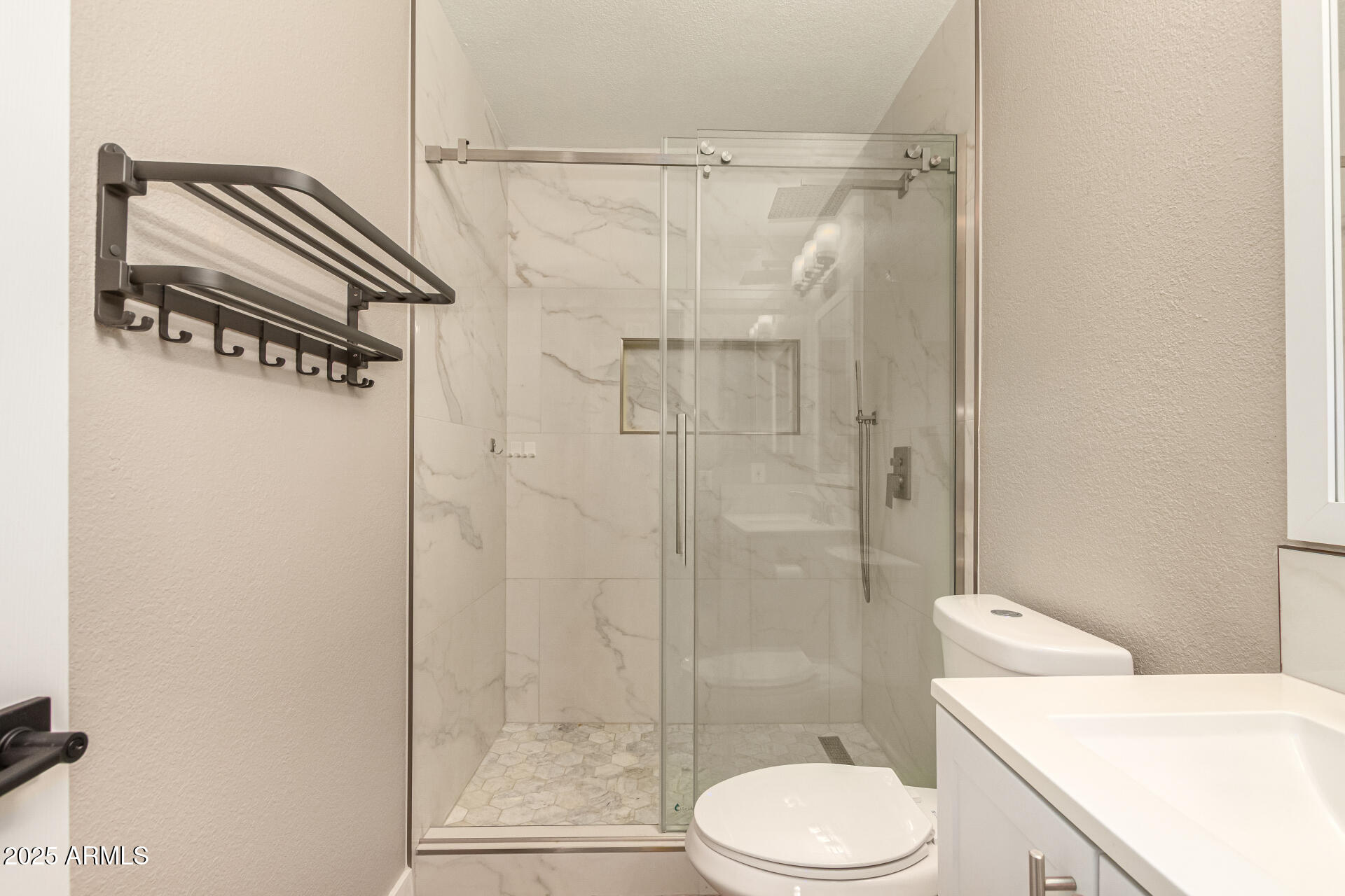 2633 West Ocotillo Road, Unit 3 Phoenix, AZ 85017 - Photo 14 of 27 a bathroom with a sink a toilet and shower