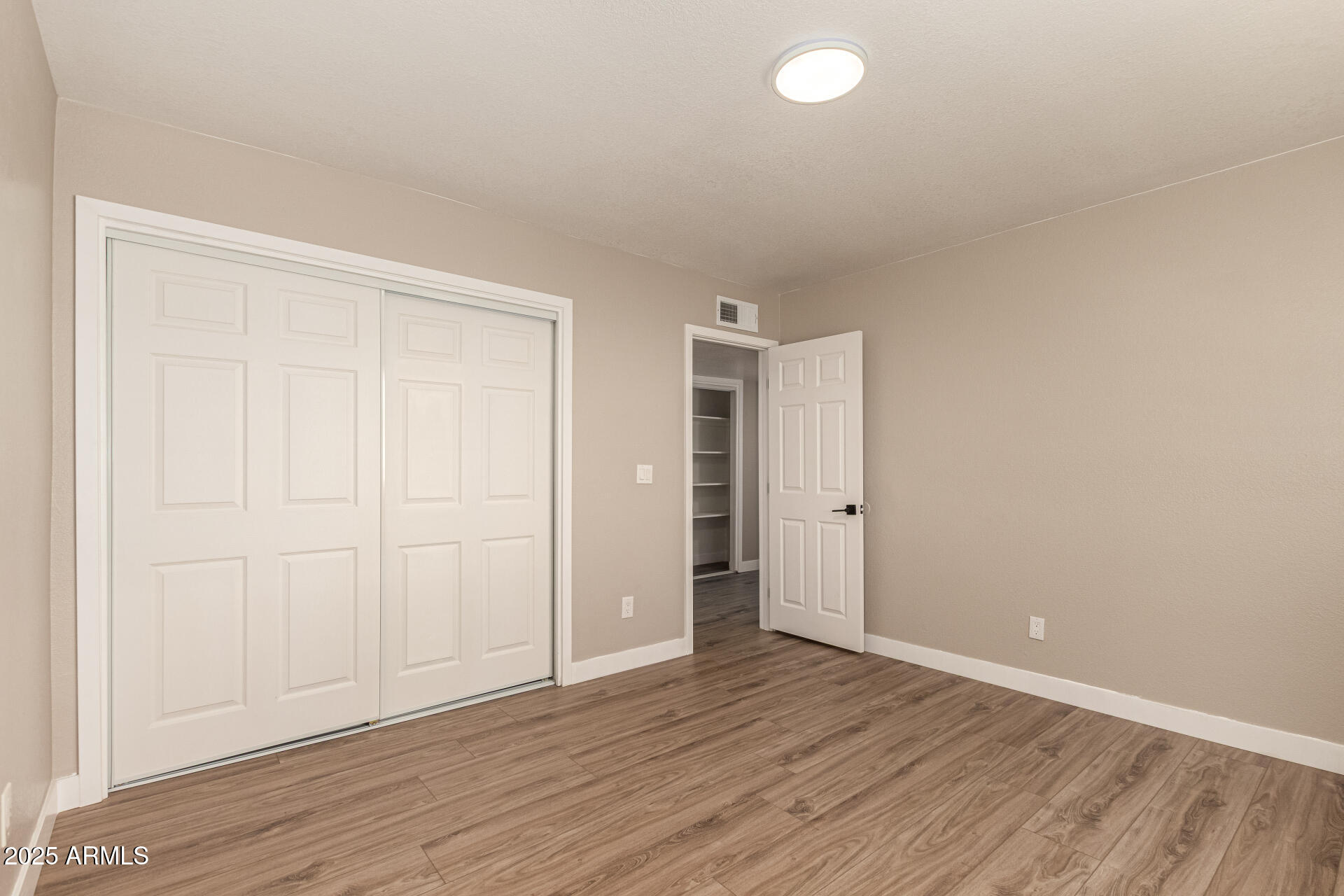 2633 West Ocotillo Road, Unit 3 Phoenix, AZ 85017 - Photo 18 of 27 wooden floor in an empty room
