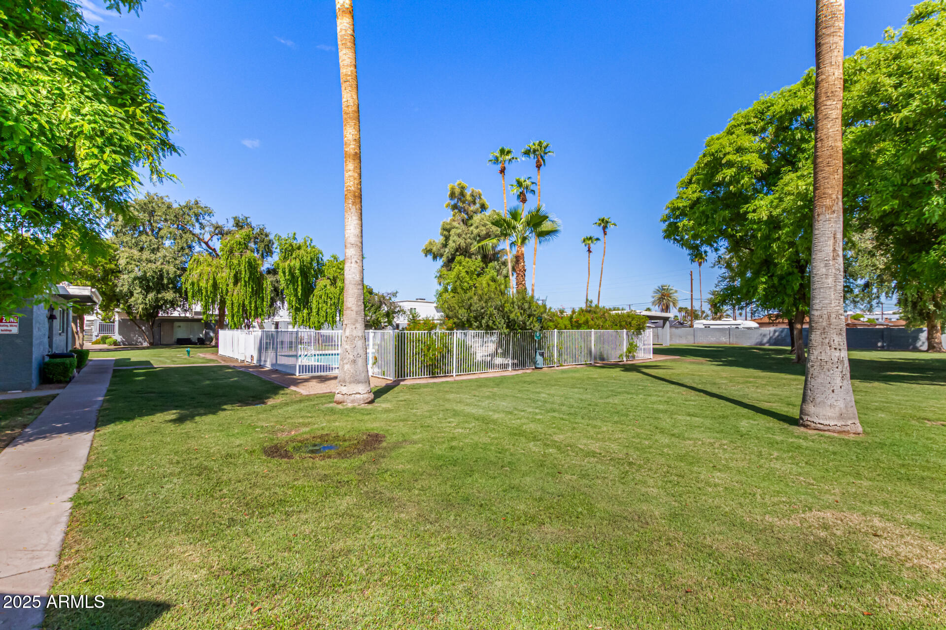 2633 West Ocotillo Road, Unit 3 Phoenix, AZ 85017 - Photo 24 of 27 a green field with trees in the background