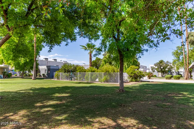 a living room with furniture a flat screen tv and a large window