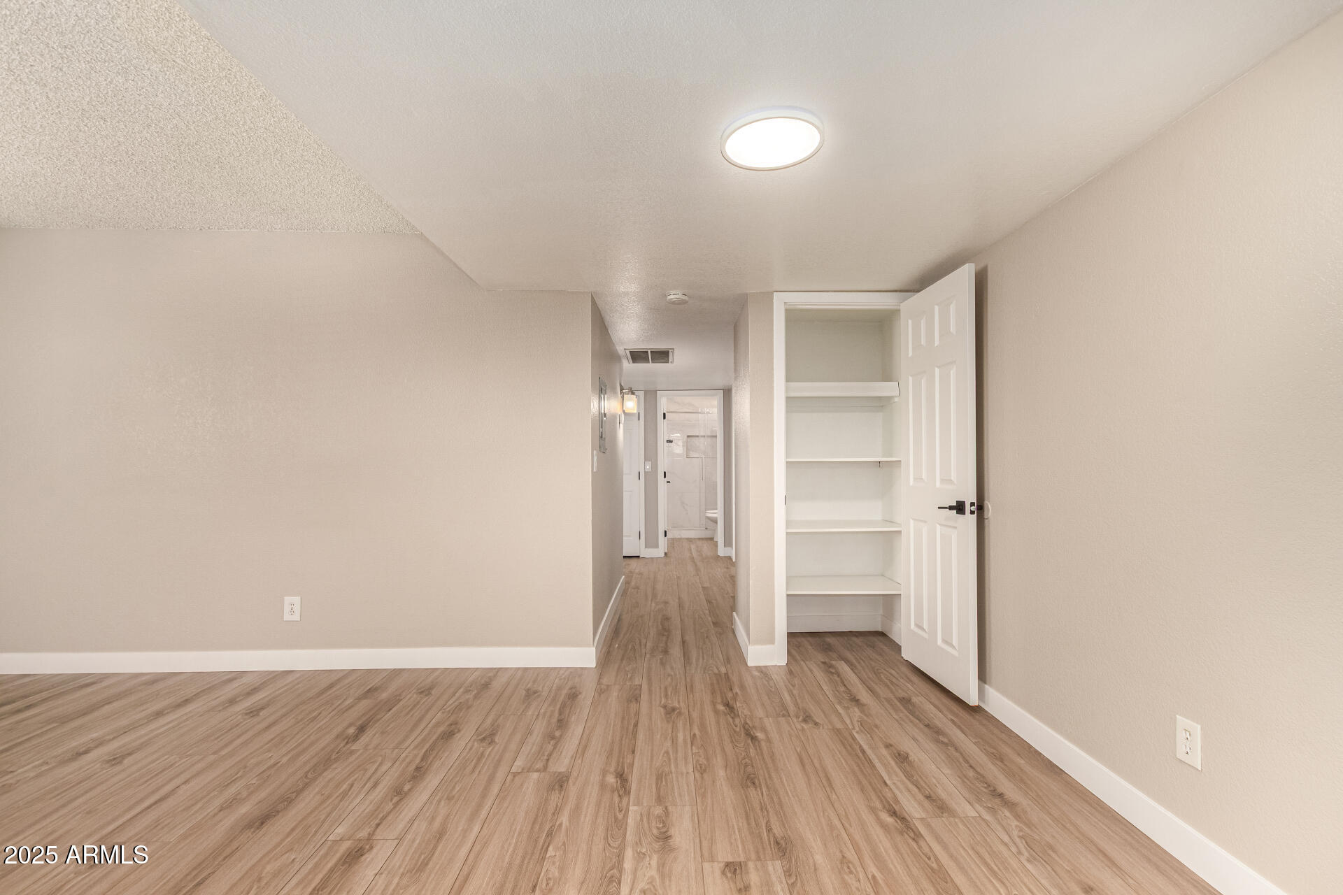 2633 West Ocotillo Road, Unit 3 Phoenix, AZ 85017 - Photo 8 of 27 a view of empty room with wooden floor