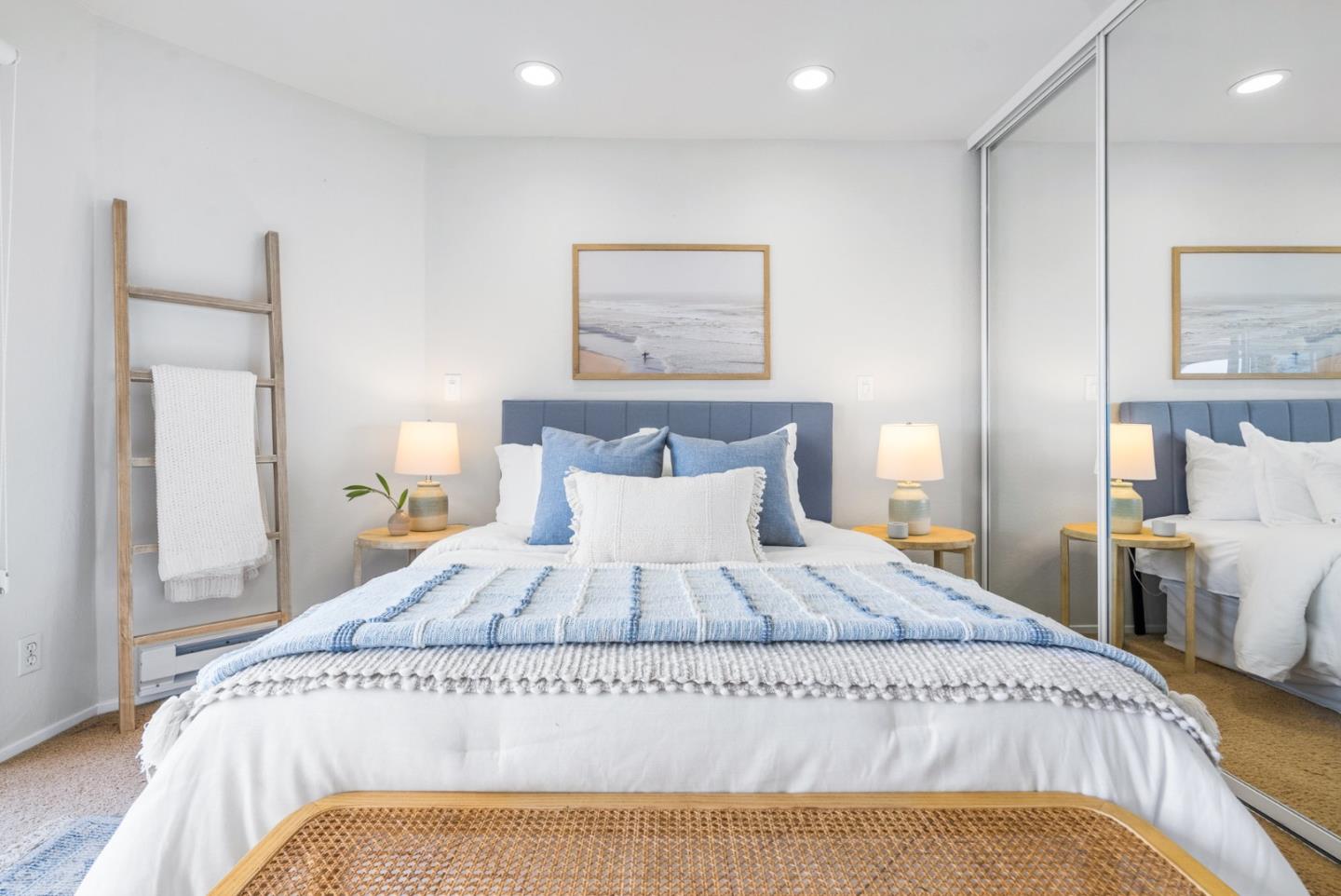 101 Shell Road, Unit 271 Watsonville, CA 95076 - Photo 30 of 43 a large bed sitting in a bedroom next to a lamp