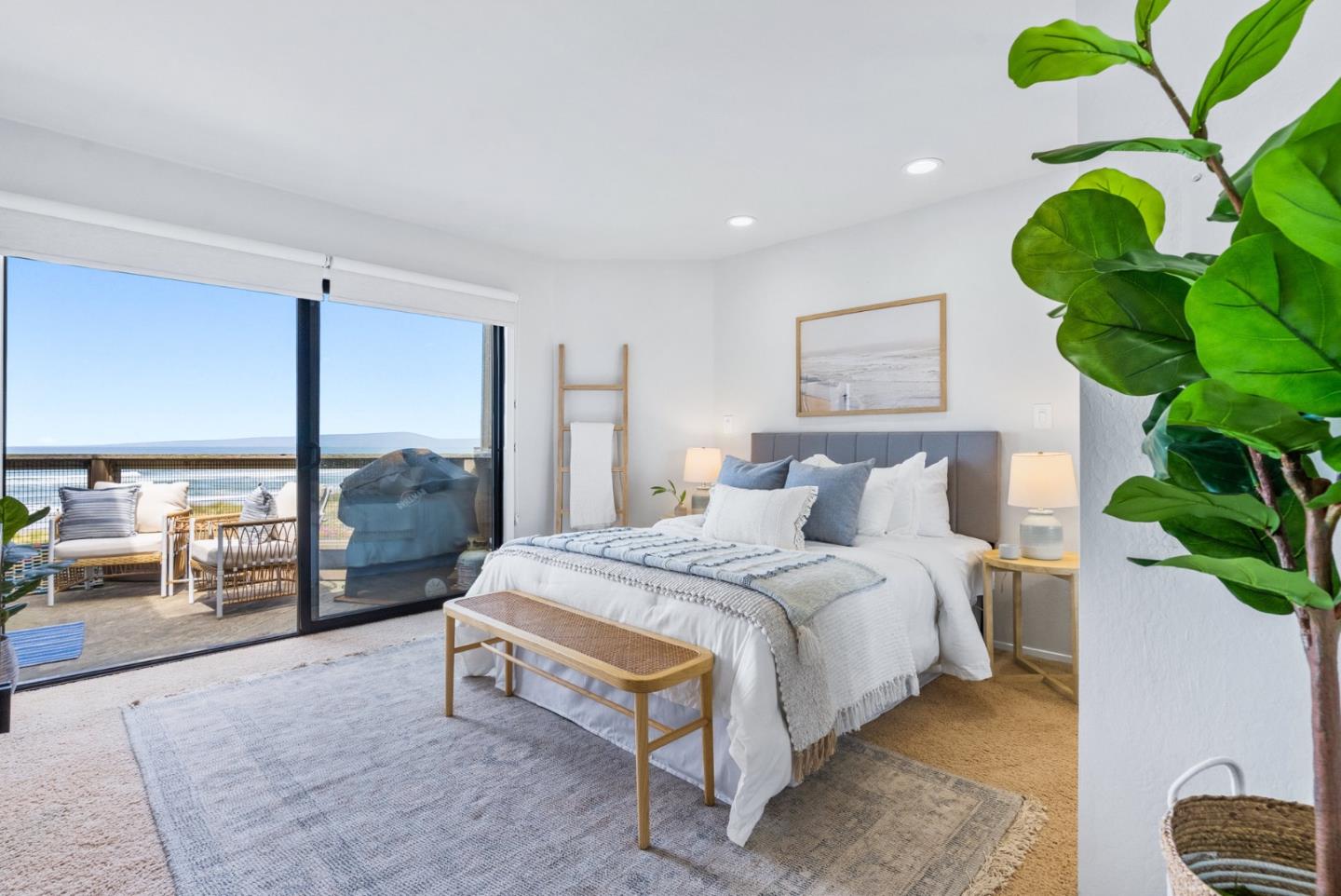 101 Shell Road, Unit 271 Watsonville, CA 95076 - Photo 31 of 43 a spacious bedroom with a bed lamp and a potted plant