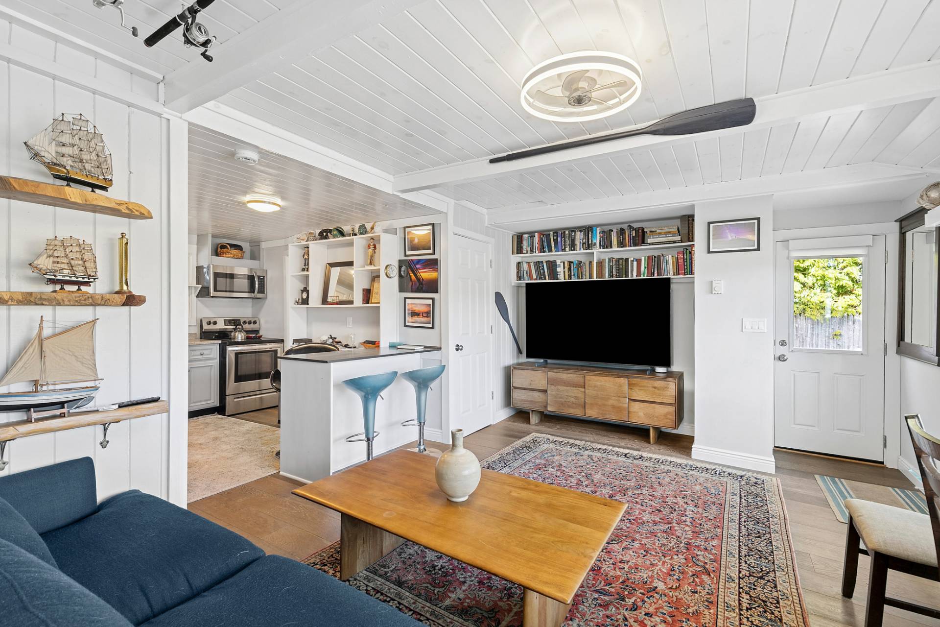 1840 North Sea Road Southampton, NY 11968 - Photo 3 of 7 a living room with furniture and a flat screen tv