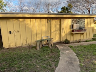7001 Twin Crest Drive Austin, TX 78752 - Photo 14 of 14 a front view of a house with a outdoor space