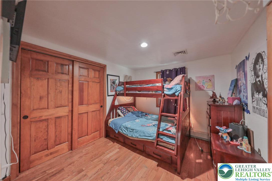 257 Hoffman Road Wind Gap, PA 18091 - Photo 12 of 52 a bedroom with furniture and a flat screen tv