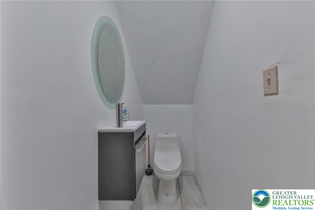 257 Hoffman Road Wind Gap, PA 18091 - Photo 19 of 52 a bathroom with a toilet and a sink