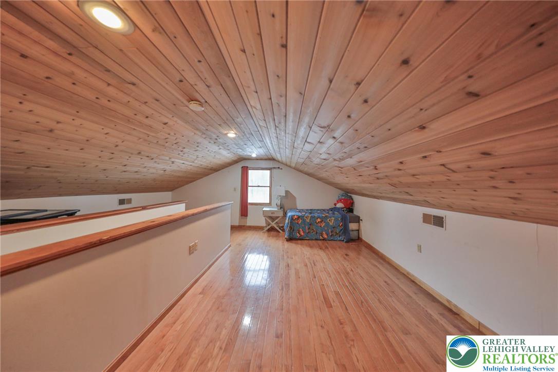 257 Hoffman Road Wind Gap, PA 18091 - Photo 22 of 52 a view of a room with stairs and a wooden floor