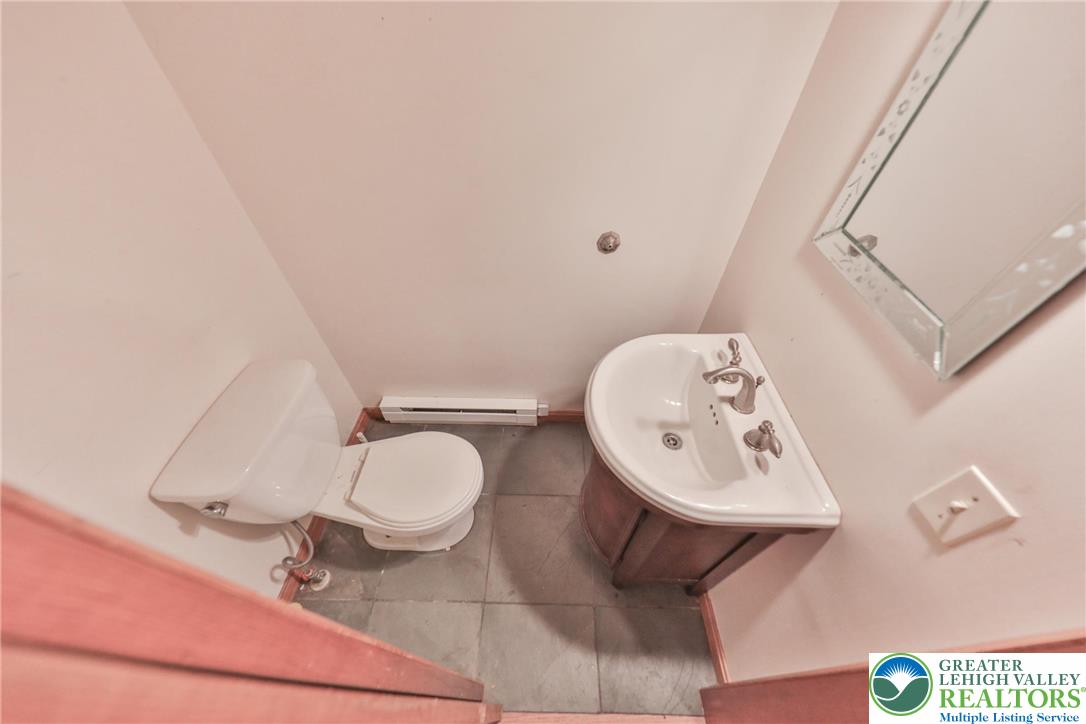 257 Hoffman Road Wind Gap, PA 18091 - Photo 23 of 52 a bathroom with a toilet and a mirror