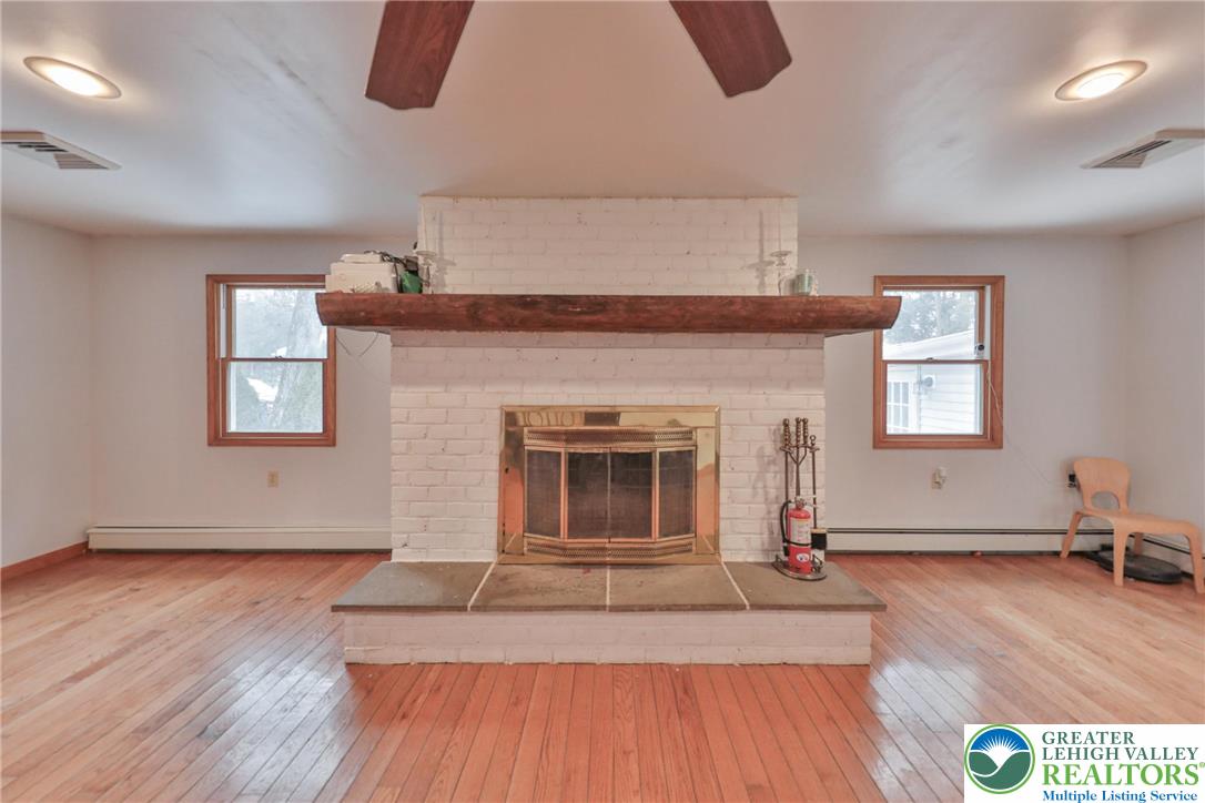 257 Hoffman Road Wind Gap, PA 18091 - Photo 24 of 52 a living room with furniture and a fireplace