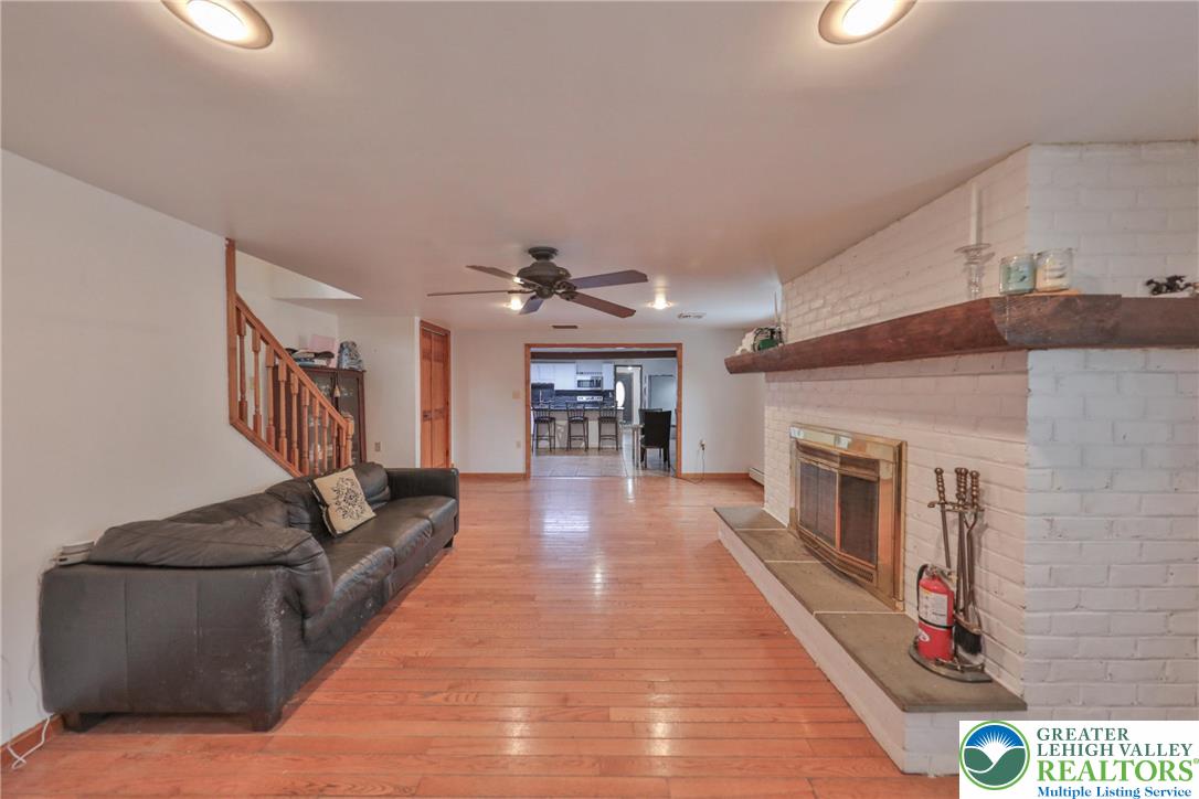257 Hoffman Road Wind Gap, PA 18091 - Photo 25 of 52 a living room with furniture and a fireplace