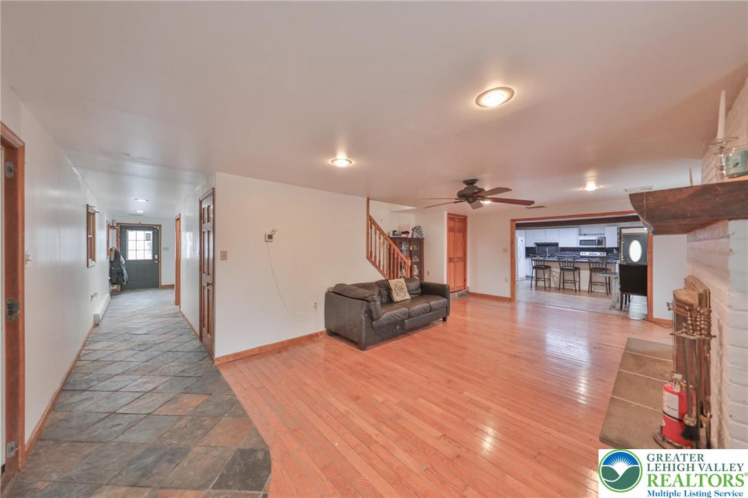 257 Hoffman Road Wind Gap, PA 18091 - Photo 26 of 52 a living room with furniture and a fireplace
