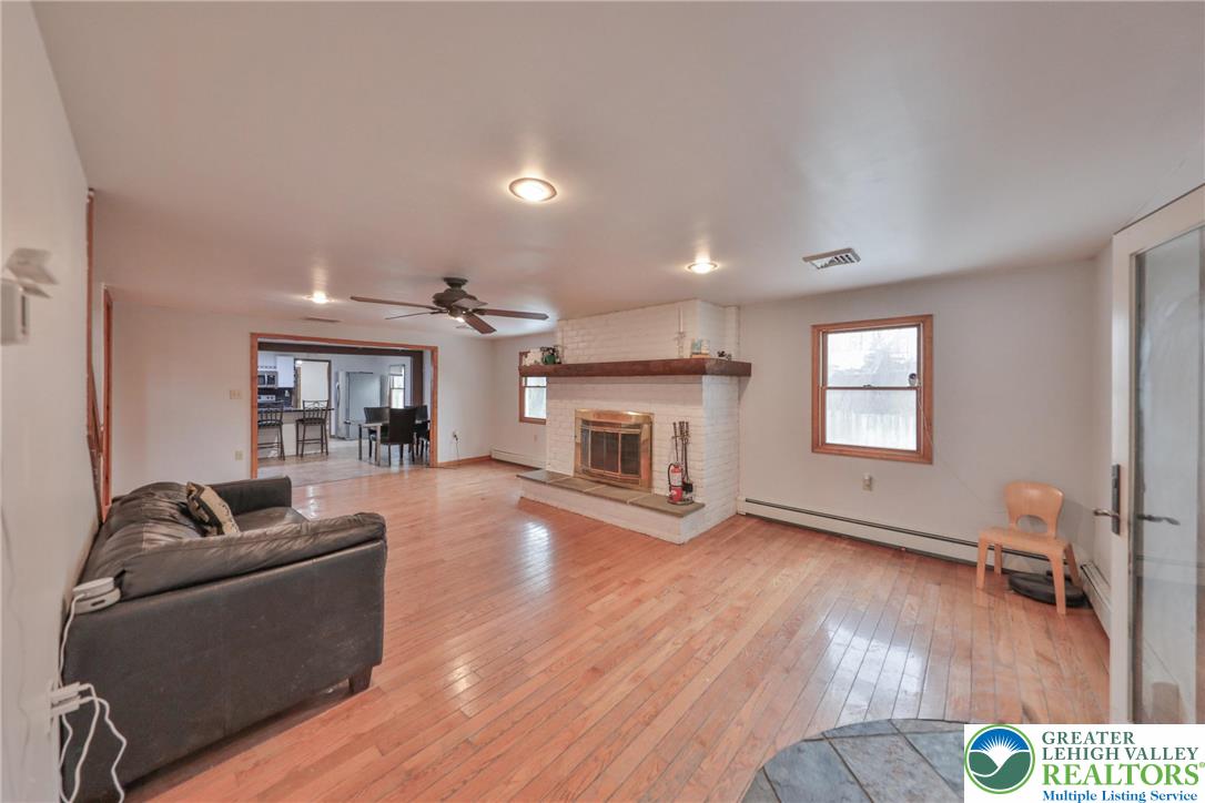 257 Hoffman Road Wind Gap, PA 18091 - Photo 27 of 52 a living room with furniture and a fireplace