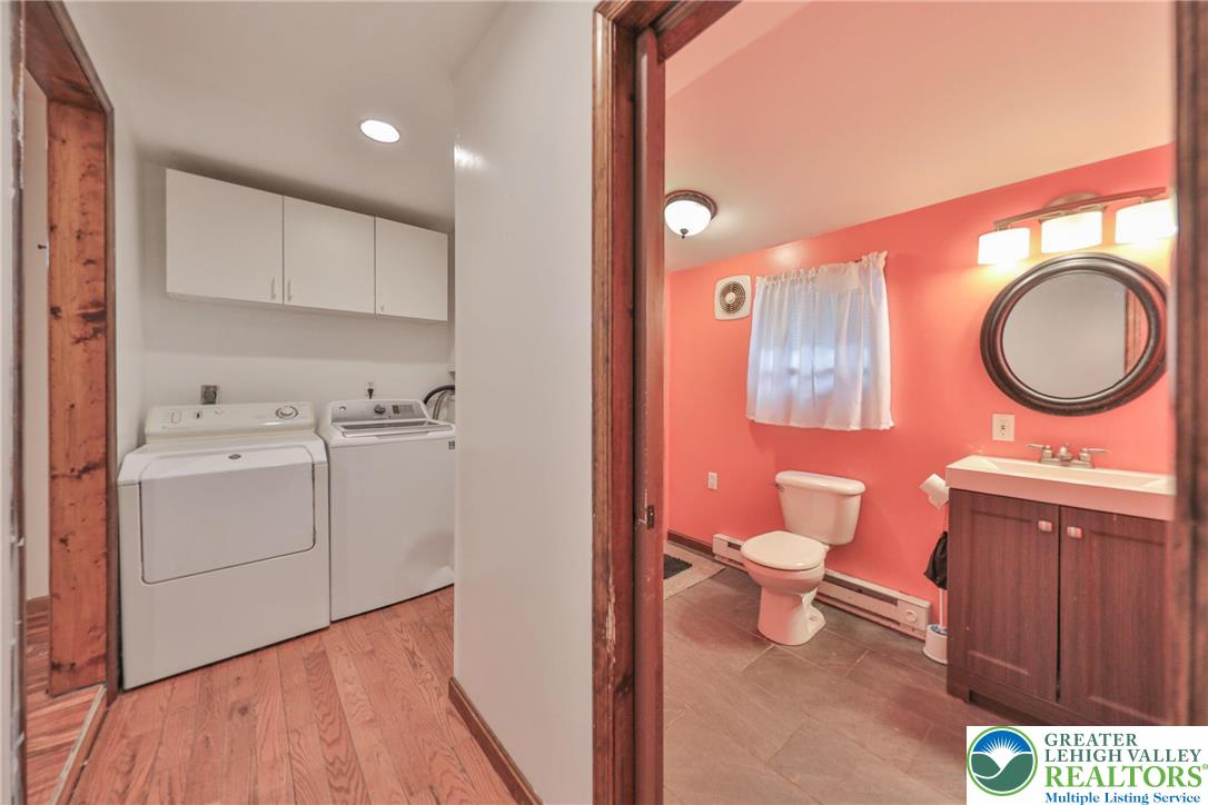 257 Hoffman Road Wind Gap, PA 18091 - Photo 43 of 52 a bathroom with a sink a toilet and vanity