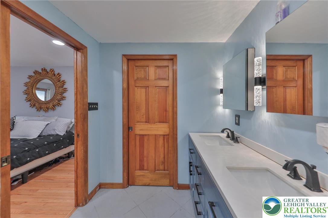 257 Hoffman Road Wind Gap, PA 18091 - Photo 8 of 52 a bathroom with a tub and a sink