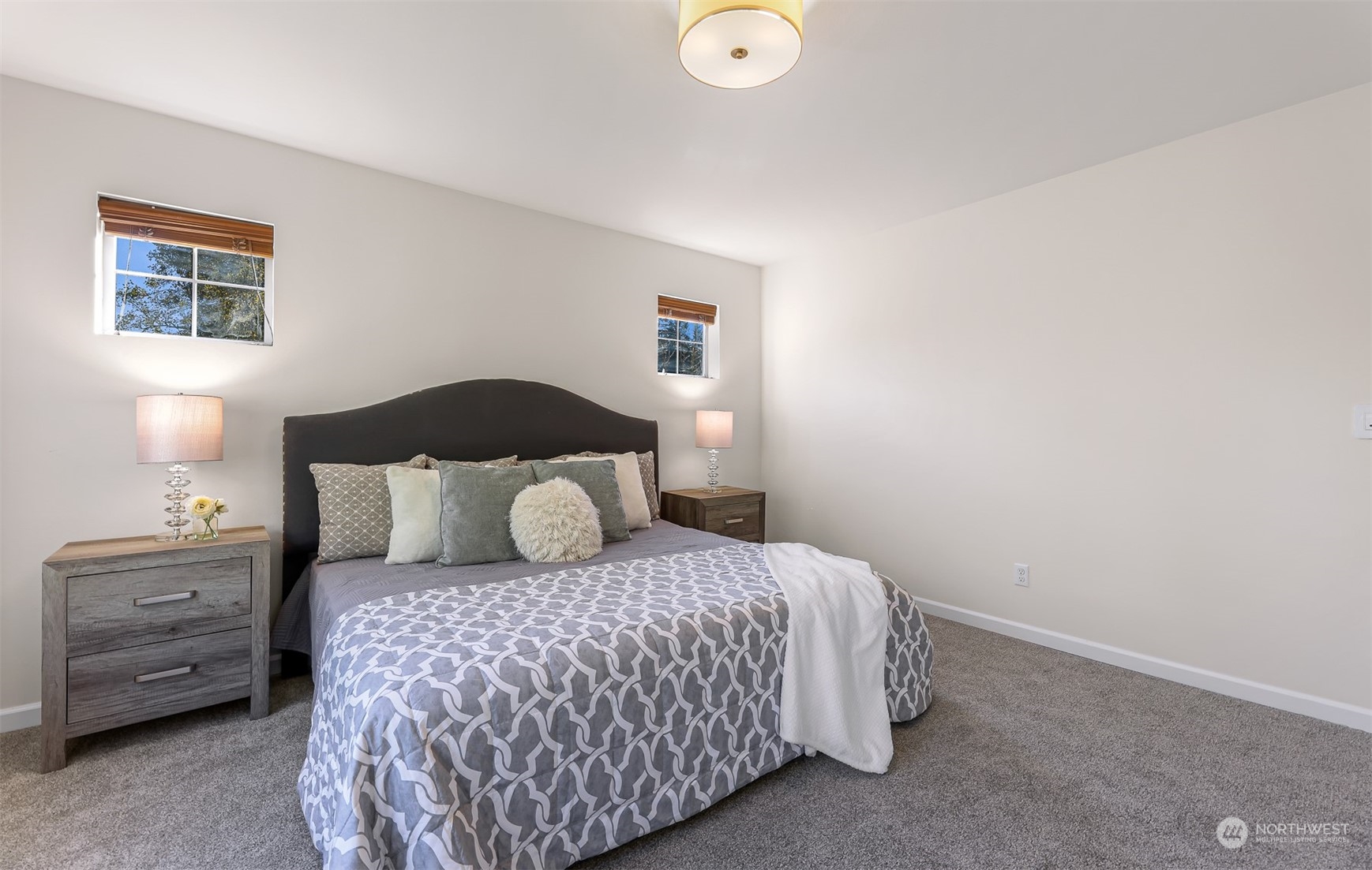 1500 Pierce Avenue Northeast Renton, WA 98056 - Photo 20 of 40 a bedroom with a bed and a night stand
