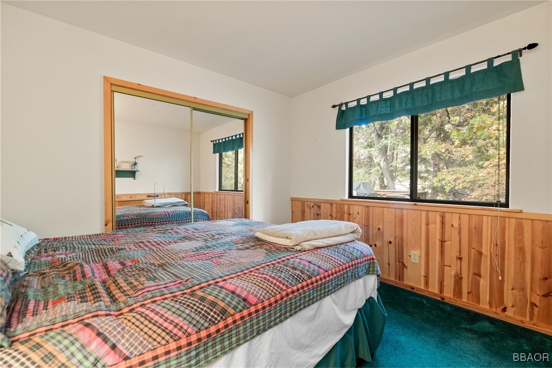 1464 Rockspray Drive Big Bear Lake, CA 92315 - Photo 13 of 26 a bedroom with a bed and window