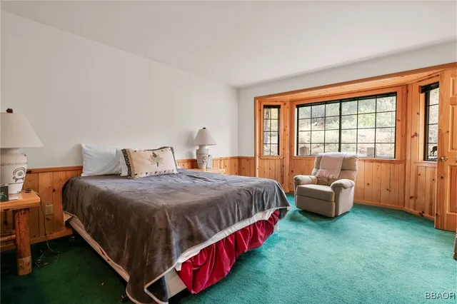 a spacious bedroom with a bed and a couch