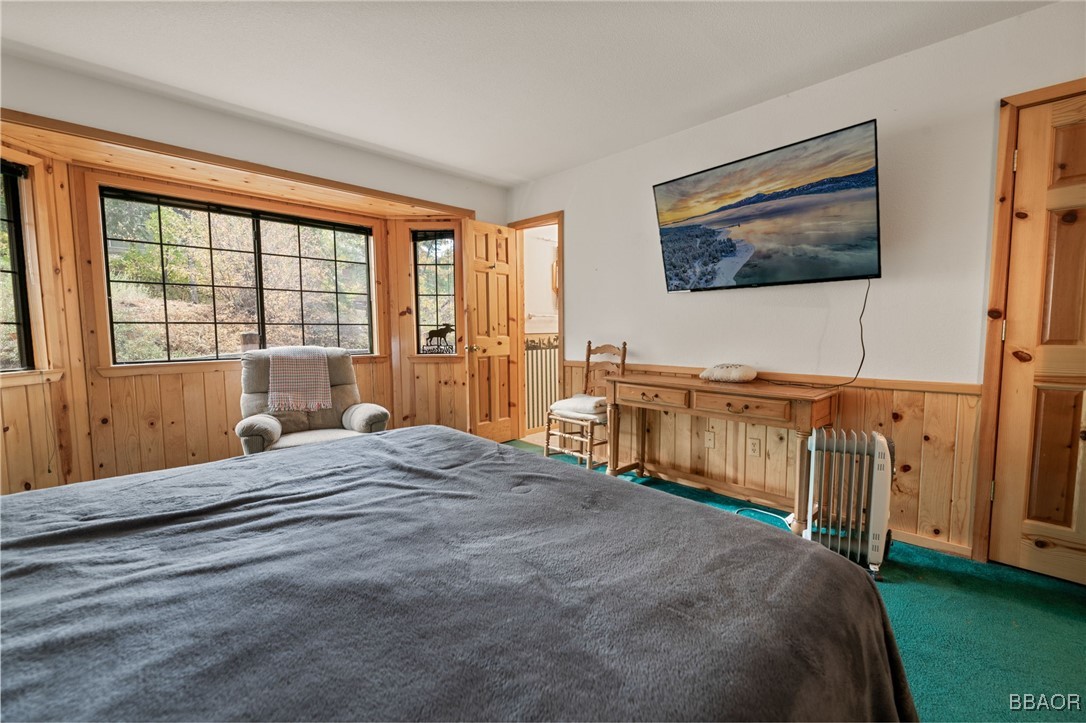 1464 Rockspray Drive Big Bear Lake, CA 92315 - Photo 20 of 26 a bedroom with a bed and a flat screen tv