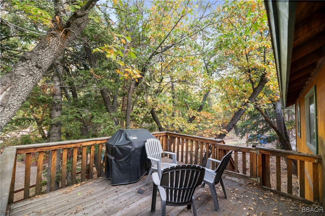 1464 Rockspray Drive Big Bear Lake, CA 92315 - Photo 24 of 26 a view of a wooden deck with a bench