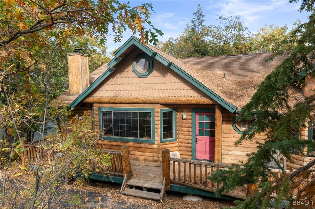 1464 Rockspray Drive Big Bear Lake, CA 92315 - Photo 3 of 26 a front view of a house with a garden