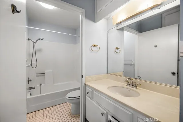 a bathroom with a sink a toilet and a shower