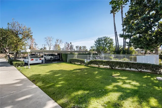 a view of a swimming pool with a yard