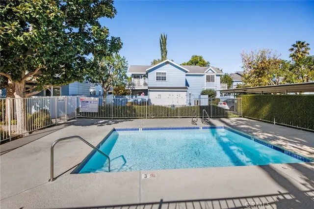 a view of a swimming pool with a patio