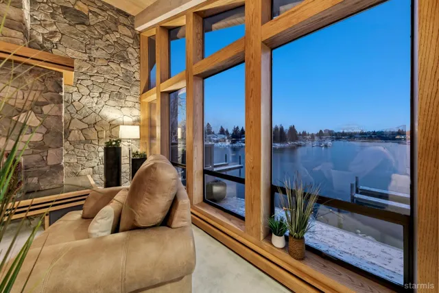 a dining room with furniture a chandelier and wooden floor