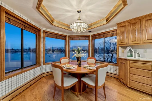a kitchen with stainless steel appliances granite countertop a sink stove and wooden cabinets