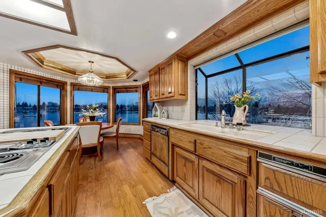 a kitchen with stainless steel appliances granite countertop a stove and cabinets