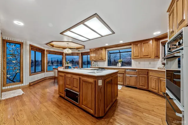 a kitchen with a sink stove and cabinets