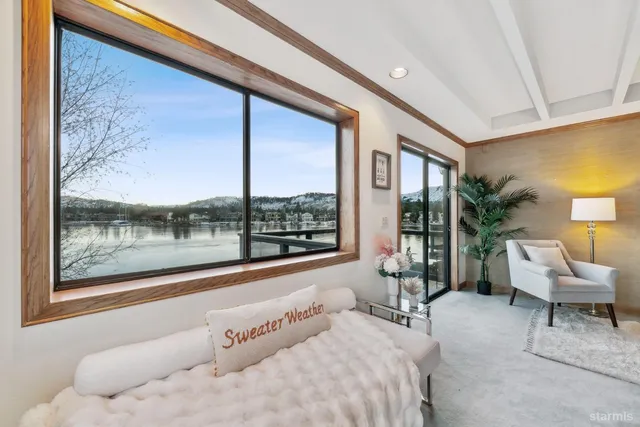 a bedroom with a bed dresser and a window