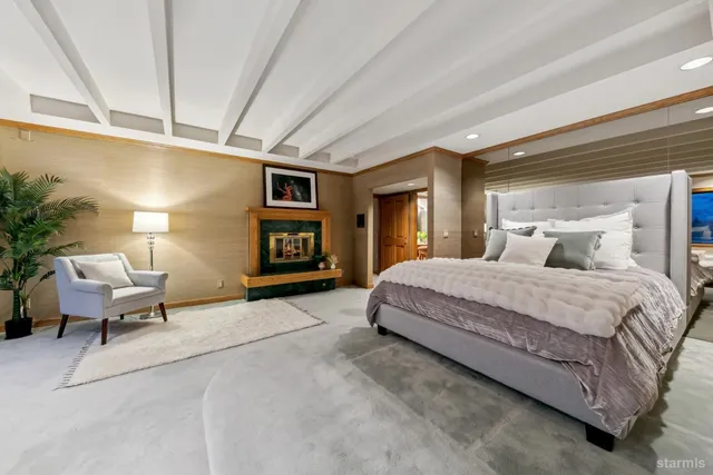 a living room with furniture a window and a clock