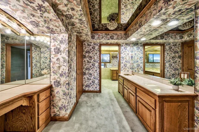 a room with lots of furniture and flat screen tv