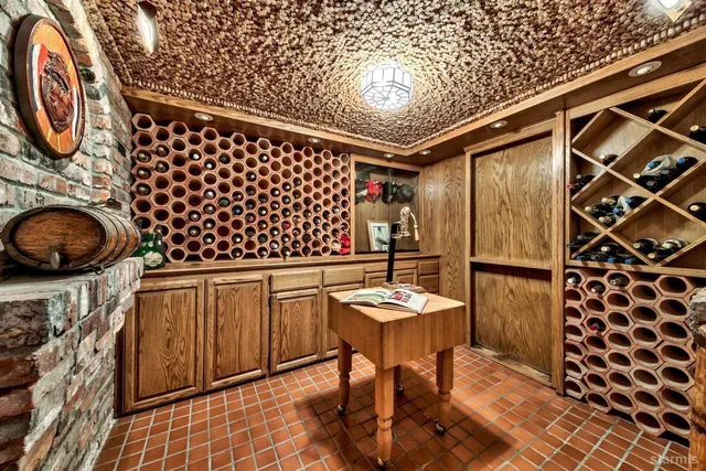 a living room with furniture a fireplace and a table