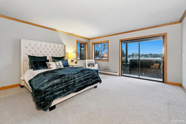 a view of a room that has a bed and a window