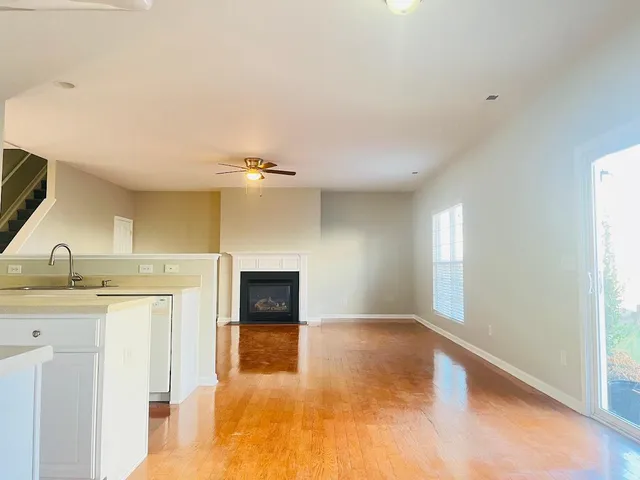 a view of a kitchen with a sink and a window