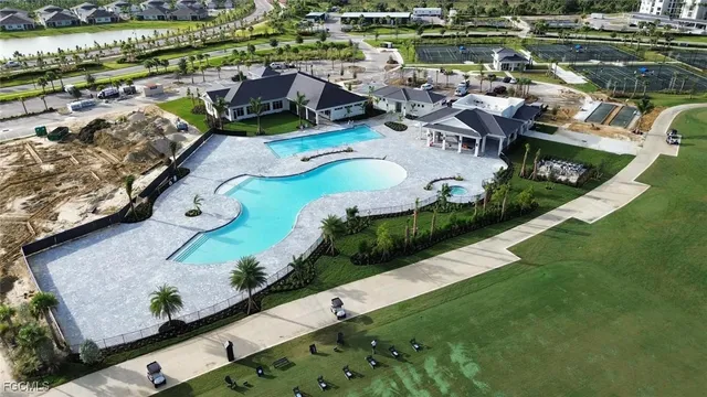 an aerial view of a house with outdoor space
