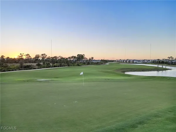 a view of a golf course with a lake