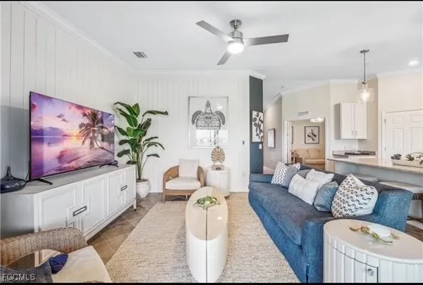 a living room with furniture and a flat screen tv