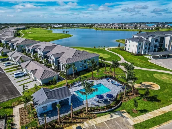 an aerial view of a city with lawn chairs