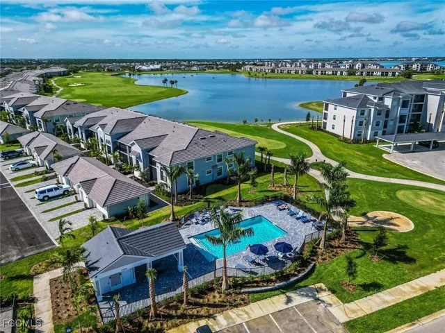 an aerial view of a city with lawn chairs