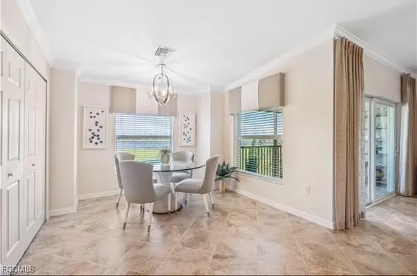 a view of a dining room with furniture window and outside view